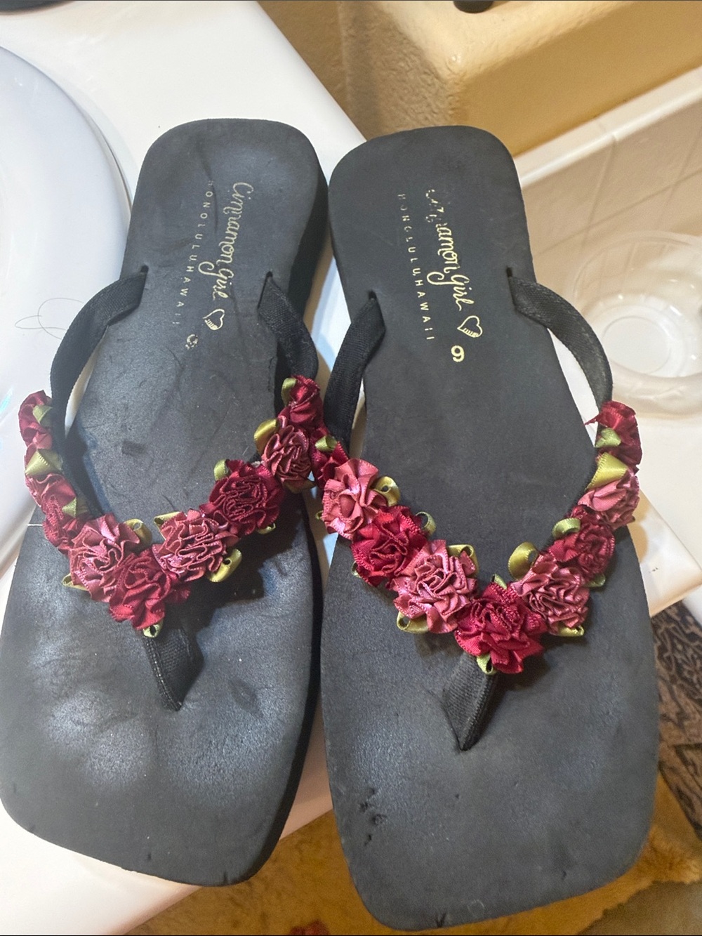 Cinnamon Girl Women's Black Sandals with Red Floral Trim